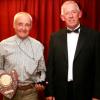 Ken Glaze receives the Pride of Ownership Standard Class winners trophy for his Mk1 Midget. 