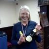 Mrs. Feathers (aka Sandy) with her chocolate winner's  medal and bottle of "champagne".