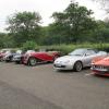More cars soon arrive to join the MG area in the car park - the red roadsters of Tim Eastham and Steve Bentley and the GT of Ron and Joyce. 