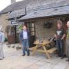 Tom, Ron and Andrew use the cobvered area for shelter as the rain started again. 