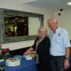 Nigel helps Mandy cut the Anniversary cake.