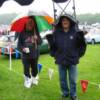 Brendan's follows Mike for shelter - note his patented wet weather footwear!