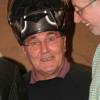 Ray decides he needed a helmet for the semi final - Dave Staniforth laughs as he realises that his head was too big!